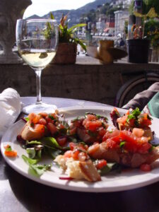 Glass of wine and plate of bruscetta in Sausalito